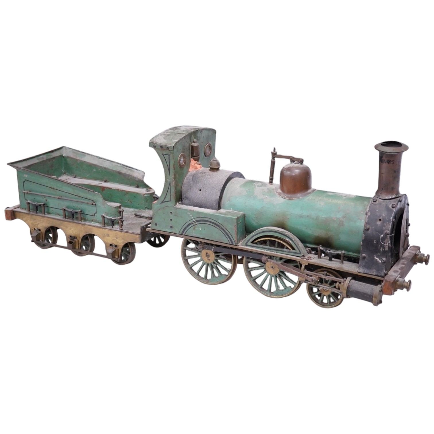 An early 20th century live steam four inch gauge 2-4-0 tender locomotive, possibly scratch built to a freelance design, spirit fired with two outside cylinders, Salter safety valve, reverser, whistle, etc. six wheel tend